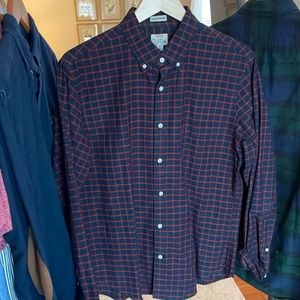 Navy button down shirt with red checker pattern
